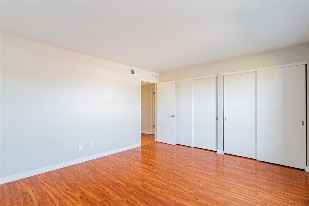 111 Rust Road, Unit 211 Bloomington, IL 61701 - Photo 10 of 15 a view of an empty room with wooden floor