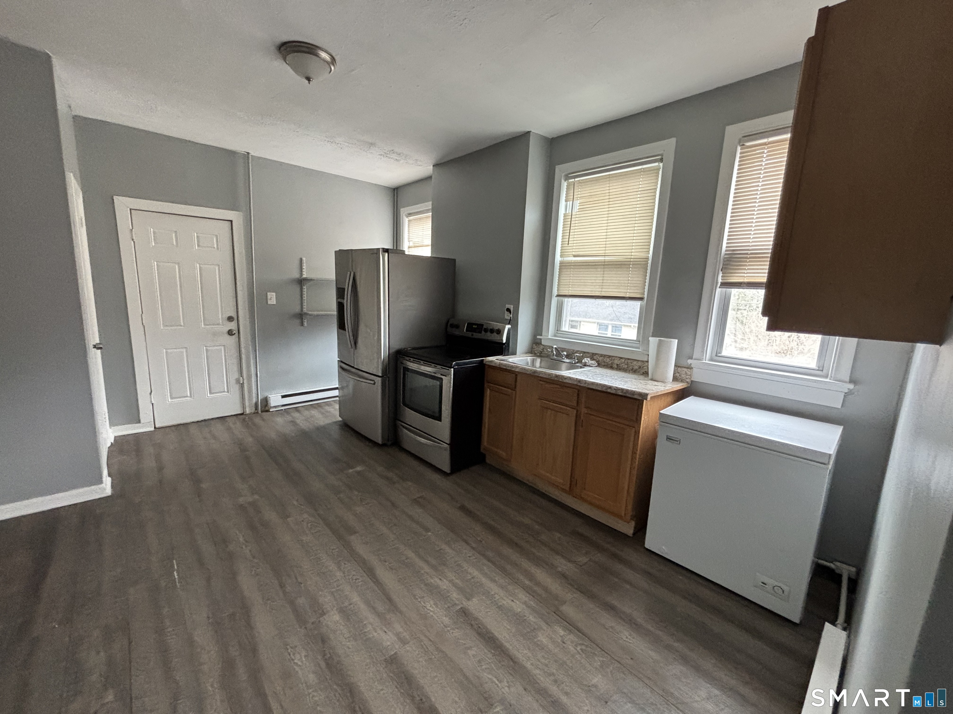 2370 Main Street Hartford, CT 06120 - Photo 7 of 7 a view of a kitchen with wooden floor and electronic appliances
