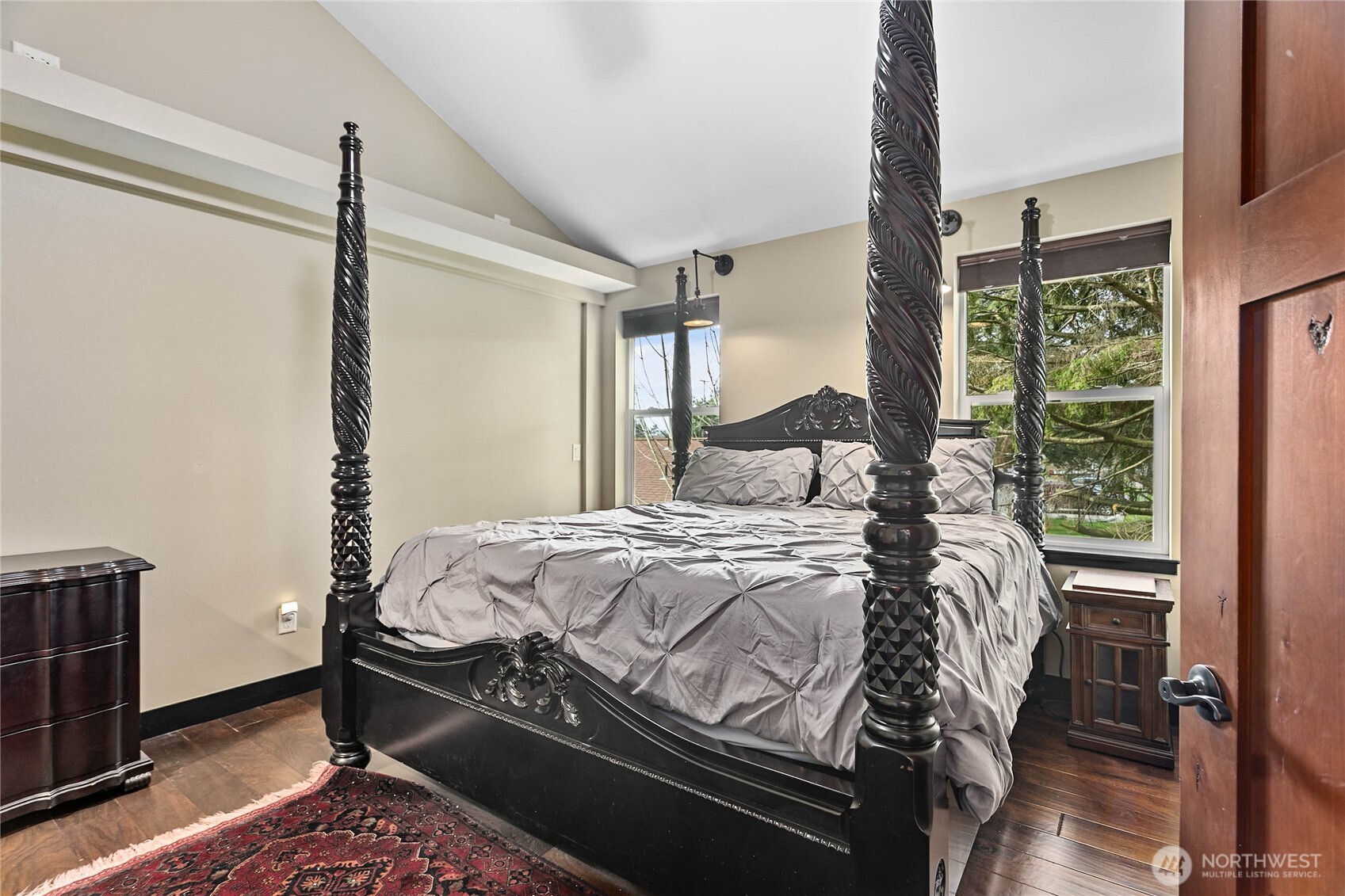 1082 West Smith Road Bellingham, WA 98226 - Photo 12 of 38 a bedroom with a bed window and a flat tv screen