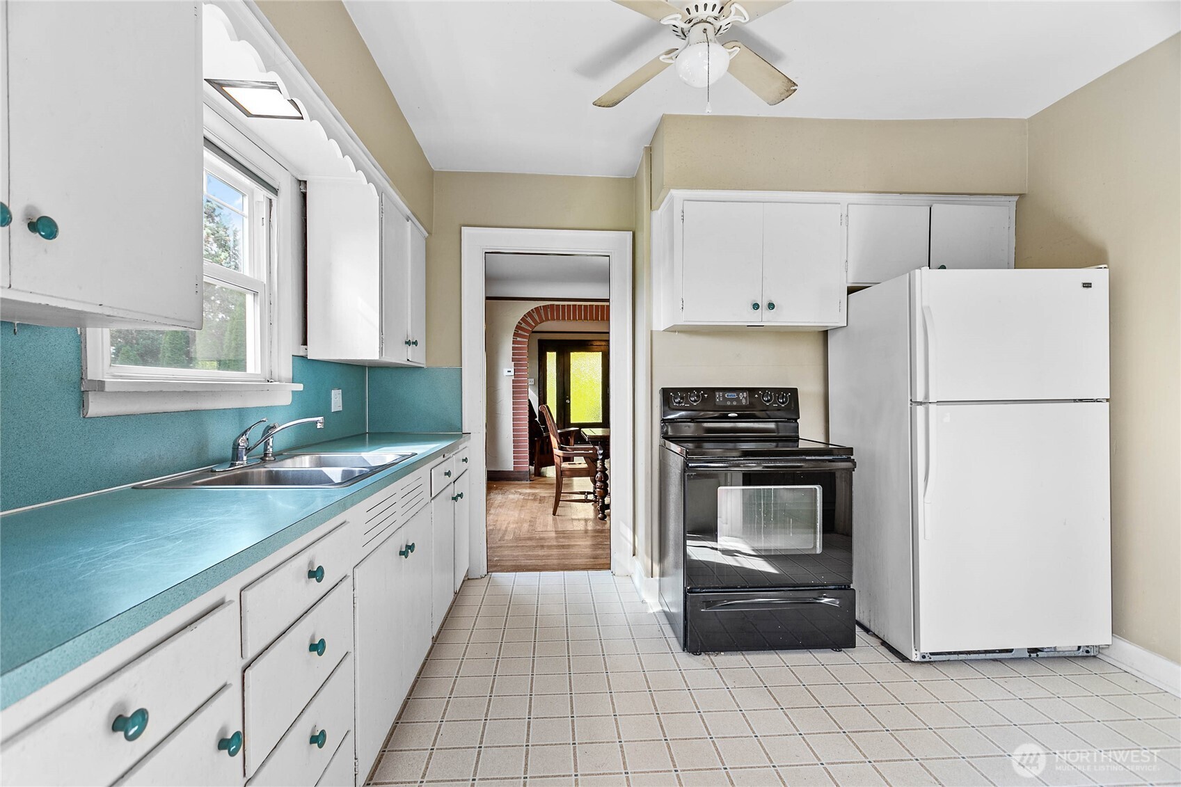 1082 West Smith Road Bellingham, WA 98226 - Photo 23 of 38 a kitchen with a refrigerator and a sink