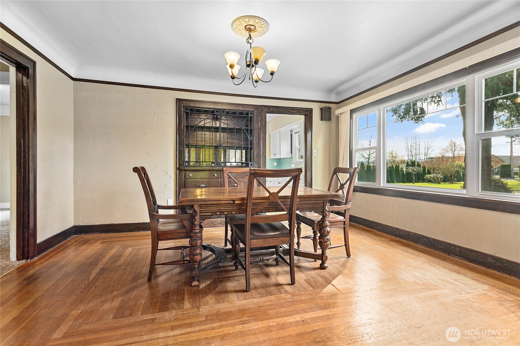 1082 West Smith Road Bellingham, WA 98226 - Photo 26 of 38 a view of a dining room with furniture a chandelier and wooden floor