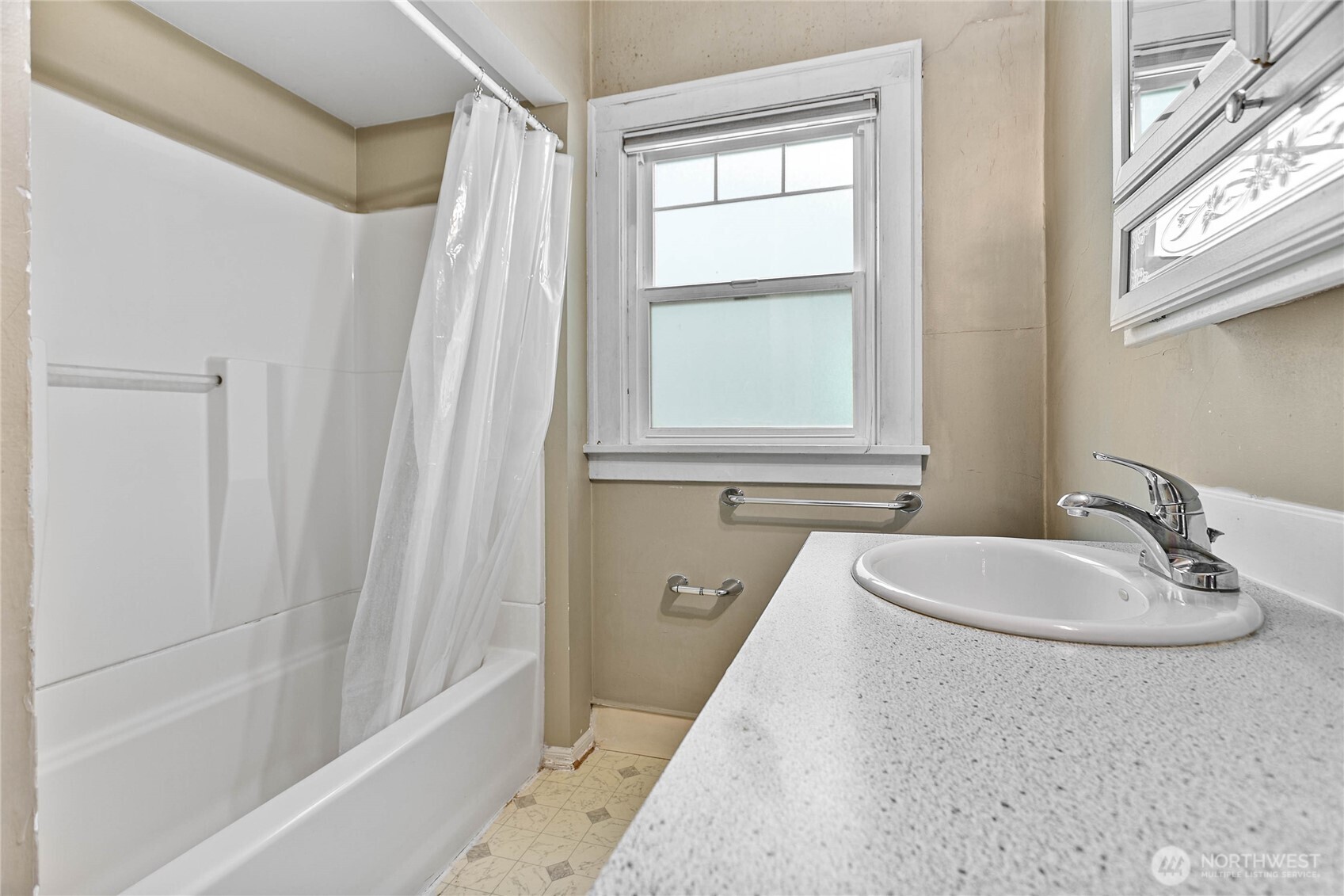 1082 West Smith Road Bellingham, WA 98226 - Photo 32 of 38 a bathroom with a granite countertop sink and a bathtub