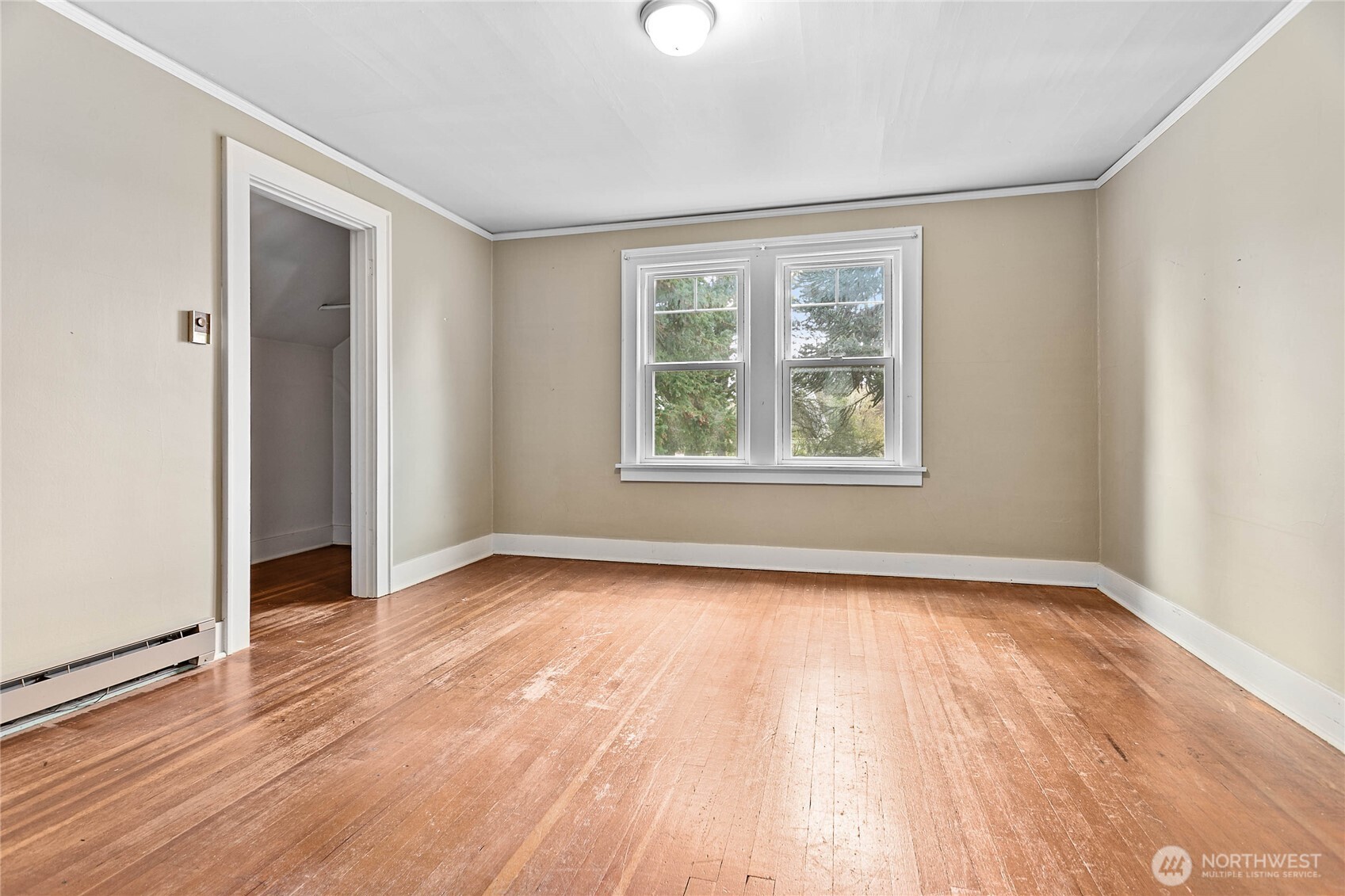1082 West Smith Road Bellingham, WA 98226 - Photo 33 of 38 a view of an empty room with wooden floor and a window