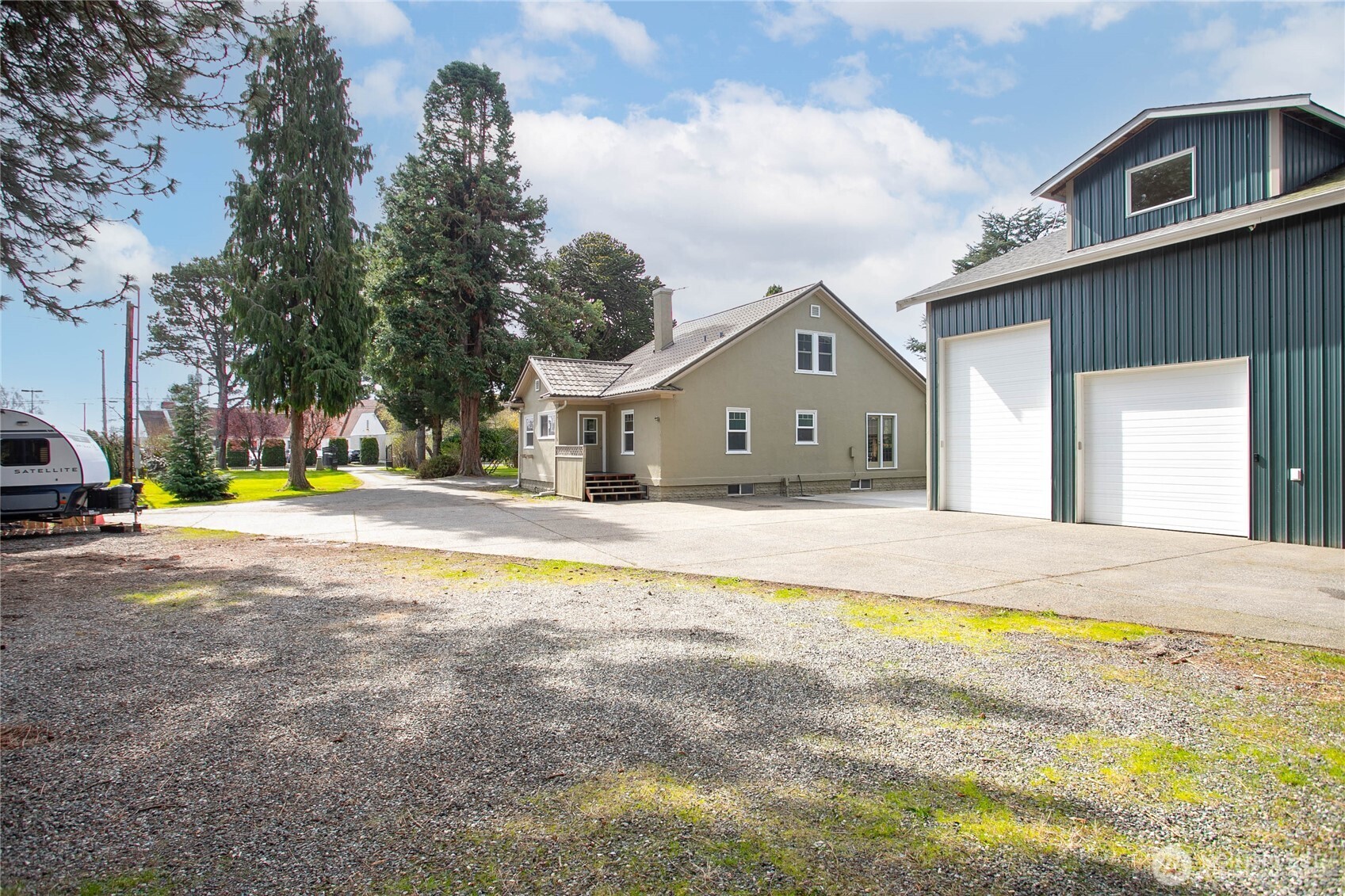 1082 West Smith Road Bellingham, WA 98226 - Photo 35 of 38 a view of a house with a swimming pool and a yard