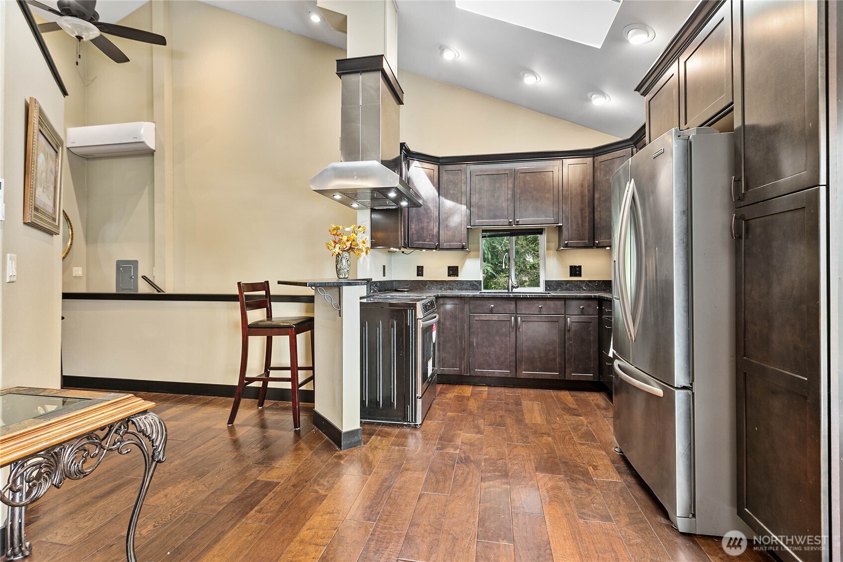 1082 West Smith Road Bellingham, WA 98226 - Photo 7 of 38 a kitchen with stainless steel appliances granite countertop a refrigerator a stove and a wooden floors