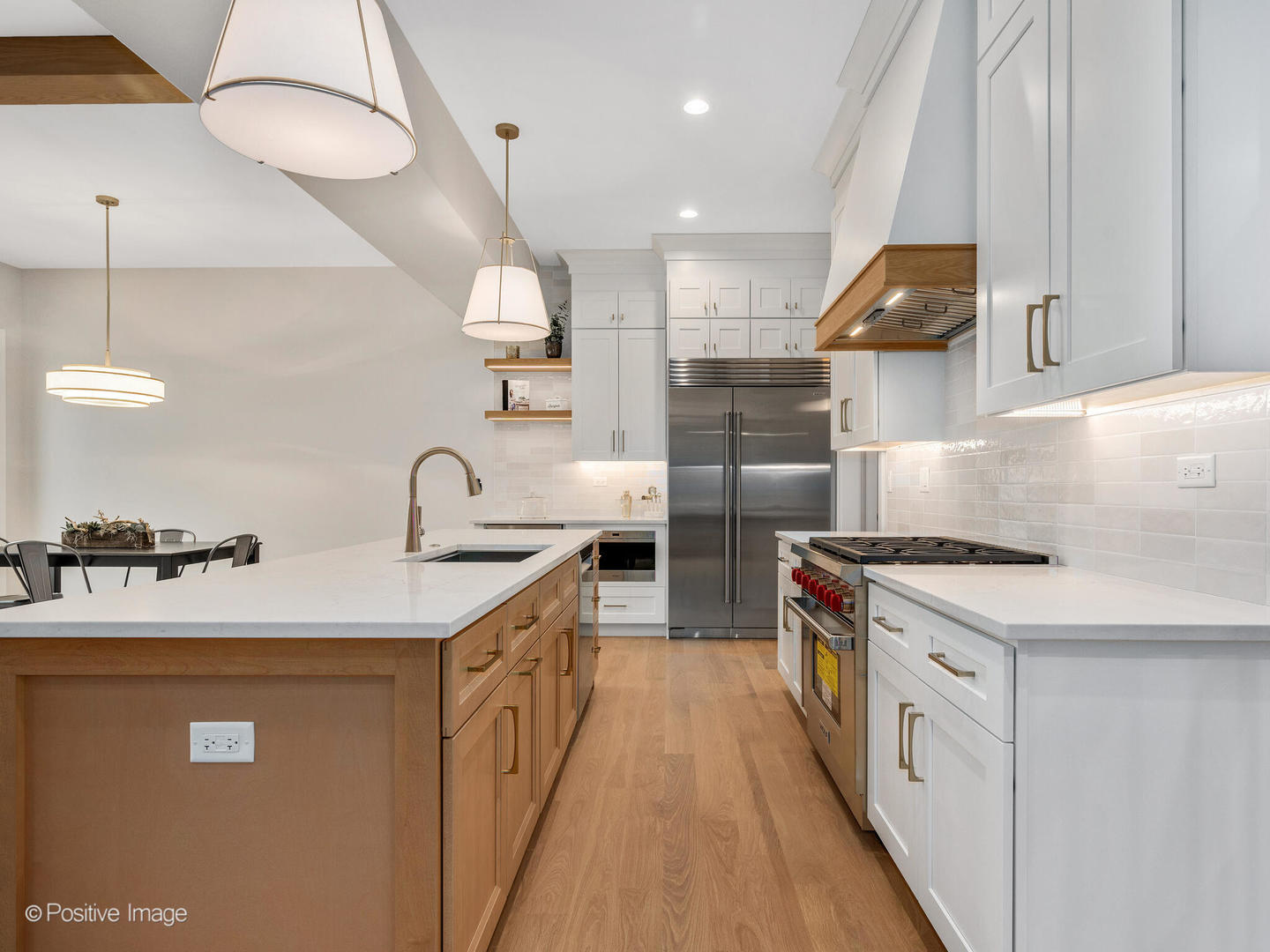 104 Evergreen Avenue Elmhurst, IL 60126 - Photo 12 of 41 a kitchen with a sink a stove and chairs