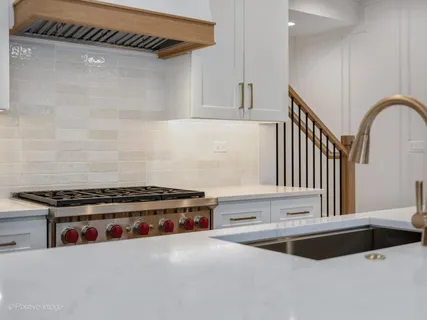 a kitchen with a stove and a microwave