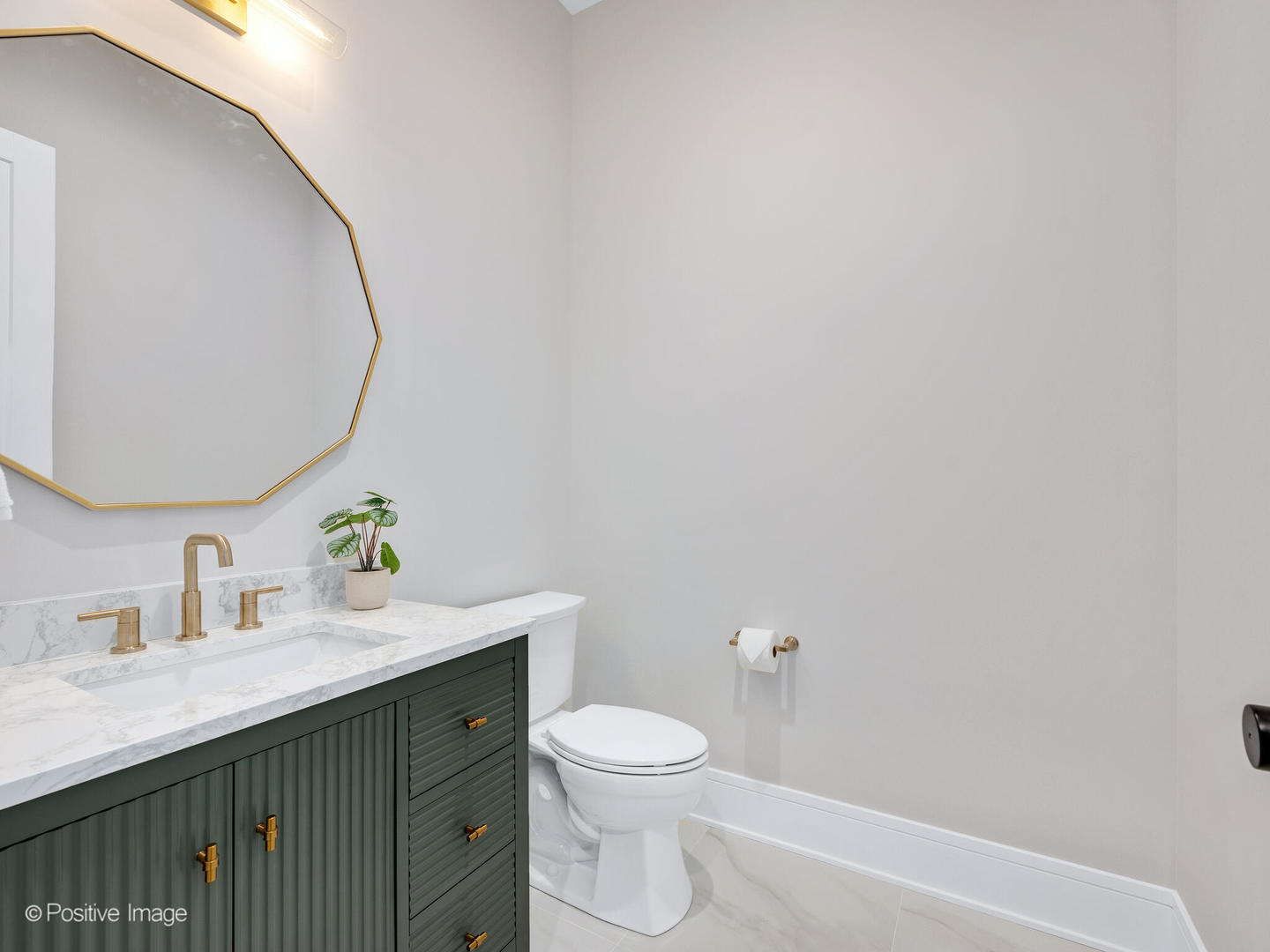 104 Evergreen Avenue Elmhurst, IL 60126 - Photo 20 of 41 a bathroom with a sink a toilet and a mirror
