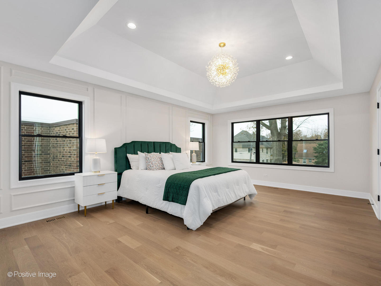 104 Evergreen Avenue Elmhurst, IL 60126 - Photo 22 of 41 a spacious bedroom with a large bed and a large window