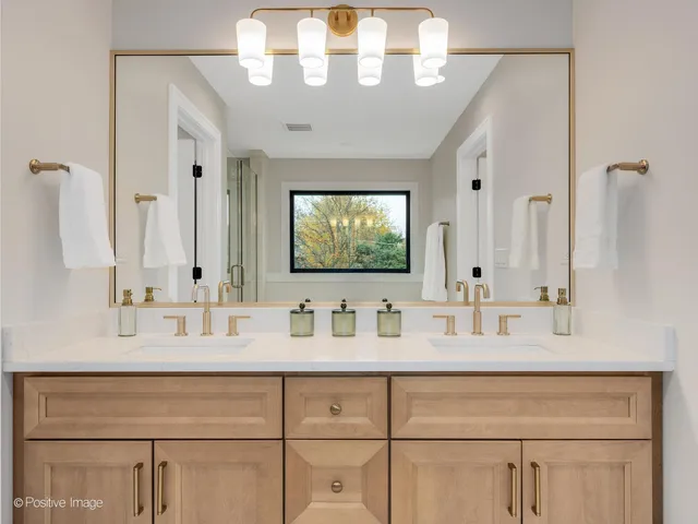 a bathroom with a sink vanity and a mirror