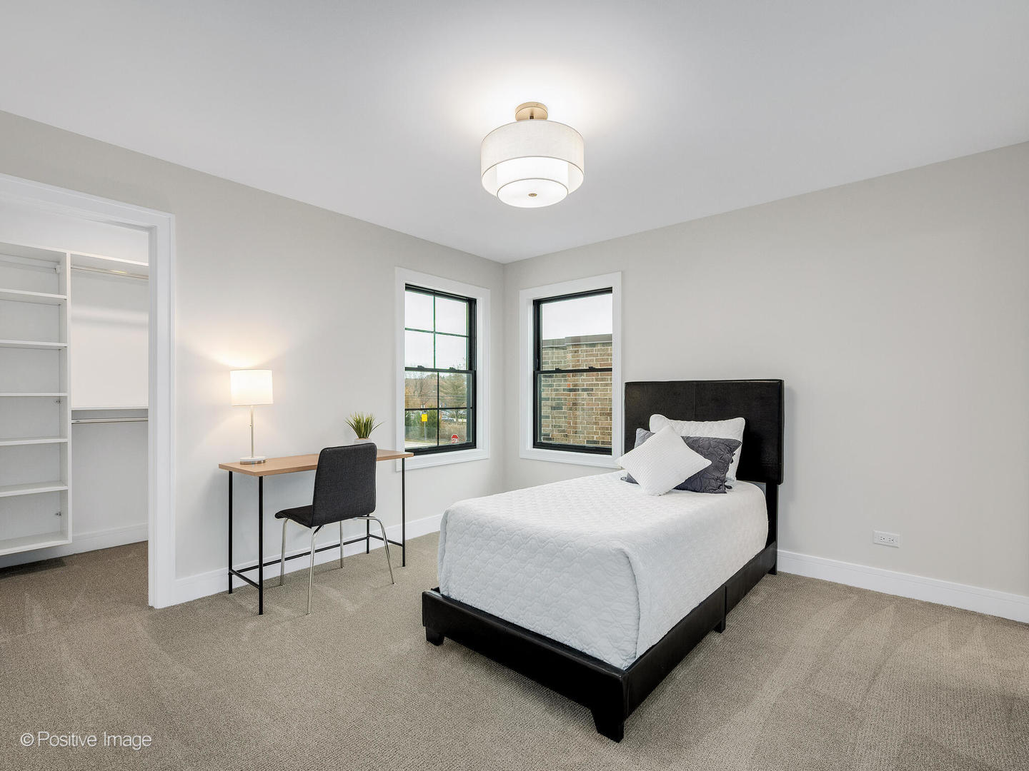 104 Evergreen Avenue Elmhurst, IL 60126 - Photo 29 of 41 a bedroom with a bed a table and chair