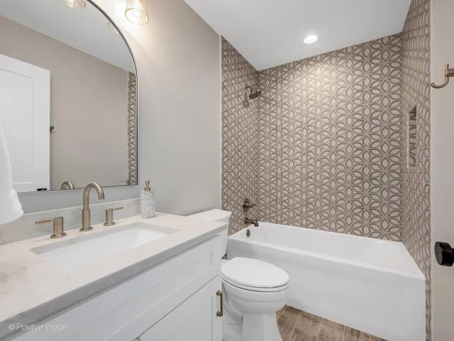 a bathroom with a sink a toilet and a bathtub