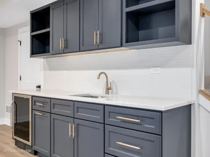 a bathroom with a sink and cabinets