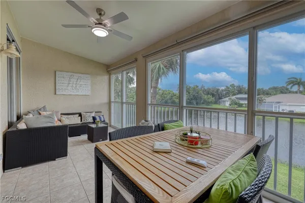 a view of a dining room and a table or chairs in a patio