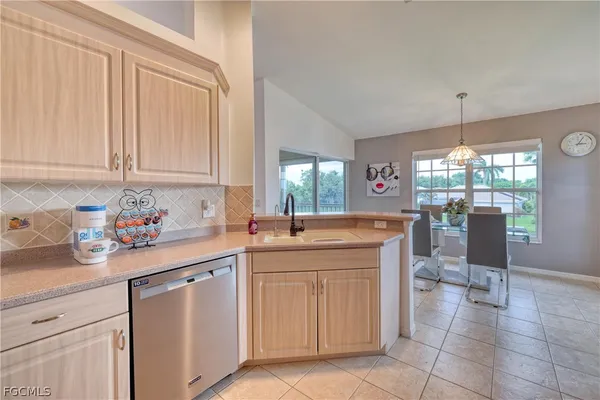 a kitchen with a sink and cabinets