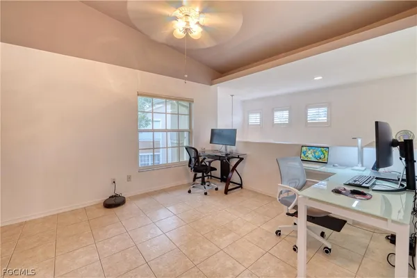 a workspace with furniture and window