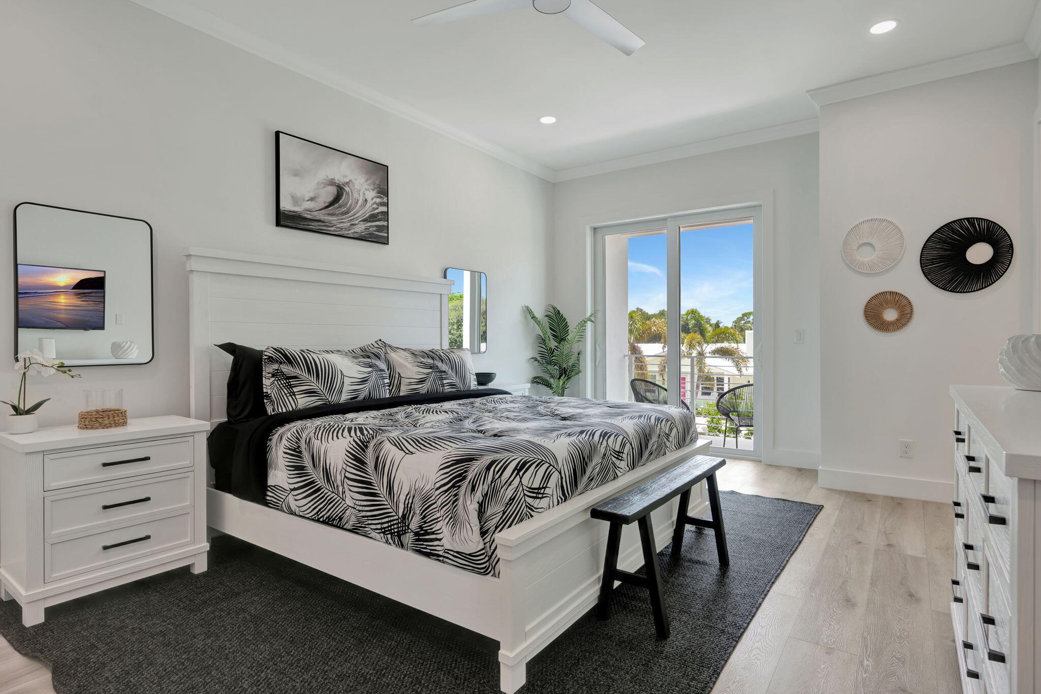 4680 Southeast Manatee Terrace Stuart, FL 34997 - Photo 13 of 34 a bedroom with a bed and a dresser