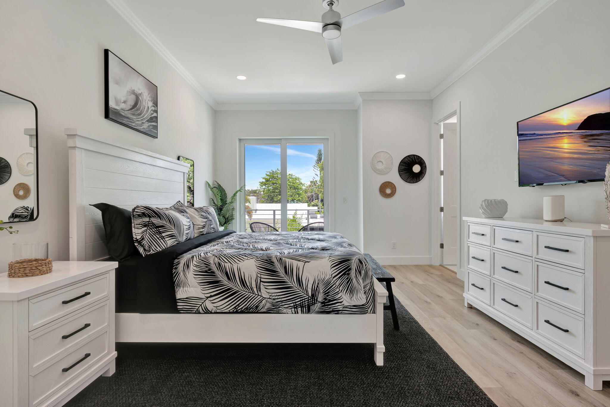 4680 Southeast Manatee Terrace Stuart, FL 34997 - Photo 14 of 34 a spacious bedroom with a bed and furniture