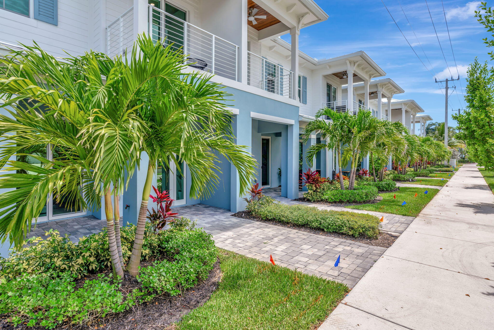 4680 Southeast Manatee Terrace Stuart, FL 34997 - Photo 2 of 34 a view of a building with a yard and plants
