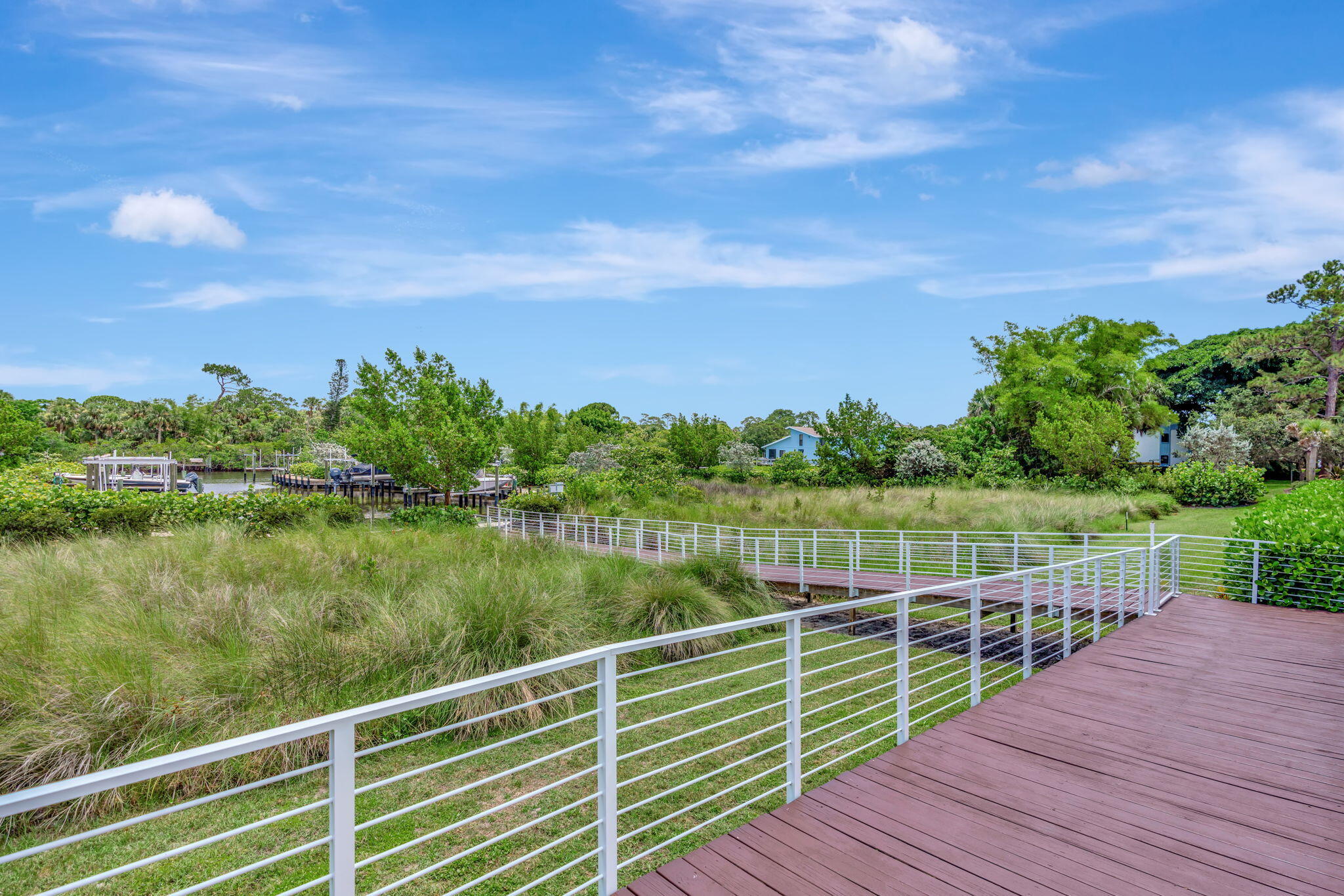 4680 Southeast Manatee Terrace Stuart, FL 34997 - Photo 26 of 34 a view of a lake from a balcony with outdoor space