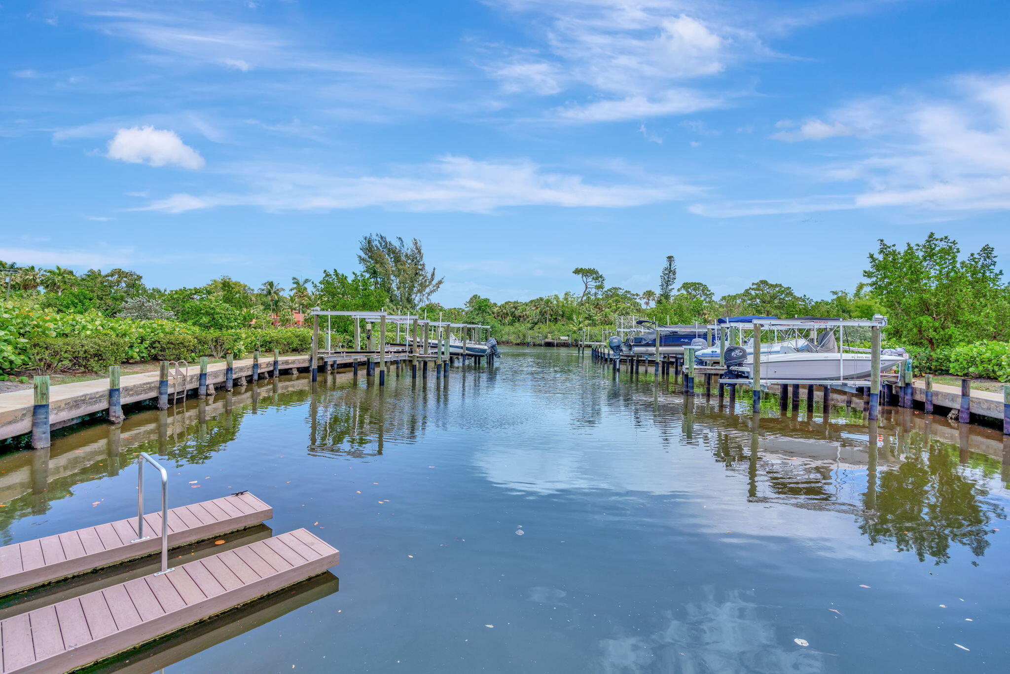 4680 Southeast Manatee Terrace Stuart, FL 34997 - Photo 28 of 34 a view of a lake with sitting area