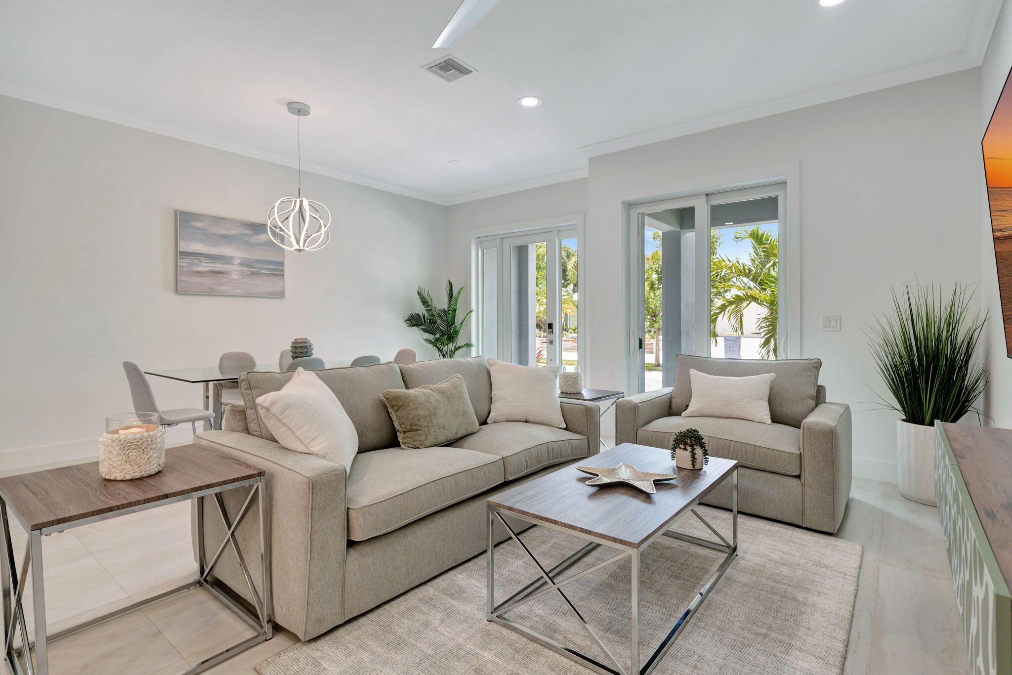 4680 Southeast Manatee Terrace Stuart, FL 34997 - Photo 7 of 34 a living room with furniture and a large window
