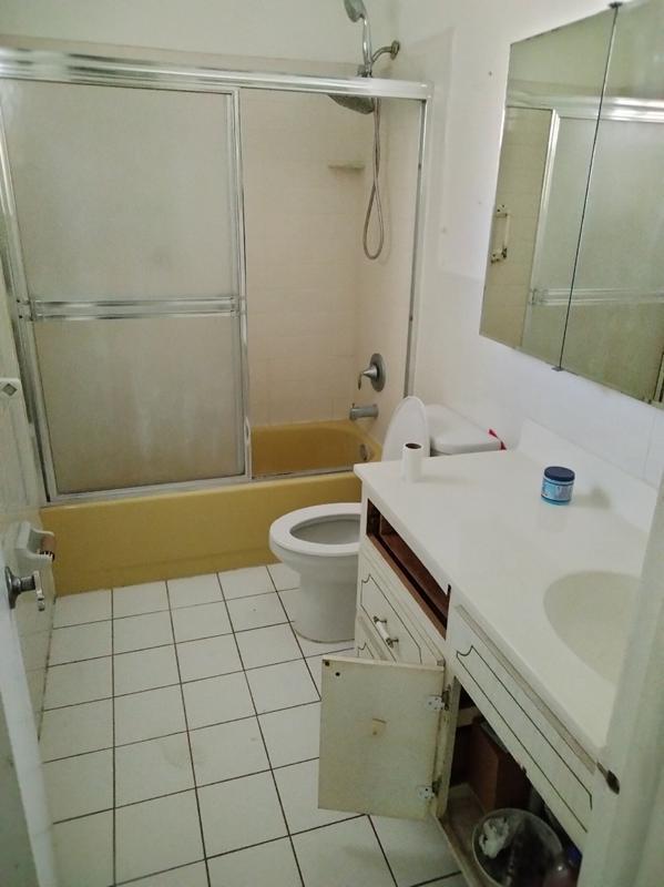 4663 Northeast 4th Avenue Boca Raton, FL 33431 - Photo 5 of 6 a bathroom with a sink a toilet and shower