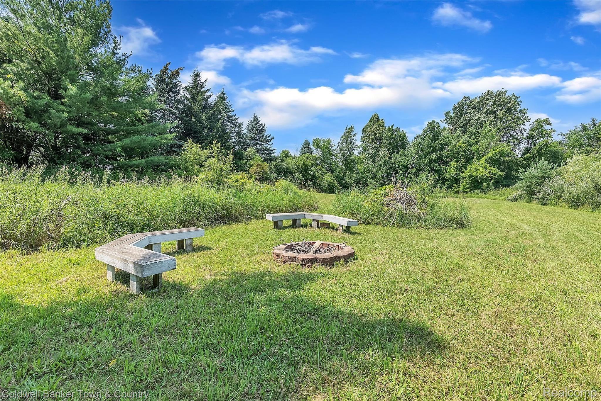 5431 Evans Road Holly, MI 48442 - Photo 56 of 81 Firepit area- safe distance from house- perfect for roasting marshmallows!
