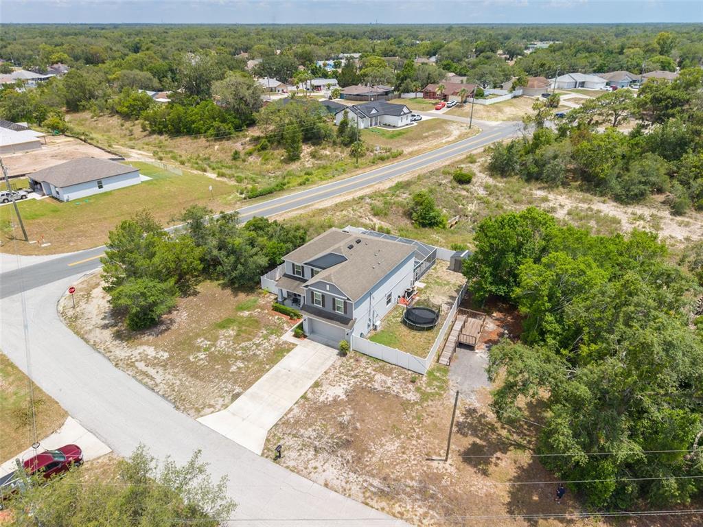 7242 Landmark Drive Spring Hill, FL 34606 - Photo 5 of 45 an aerial view of residential houses with outdoor space