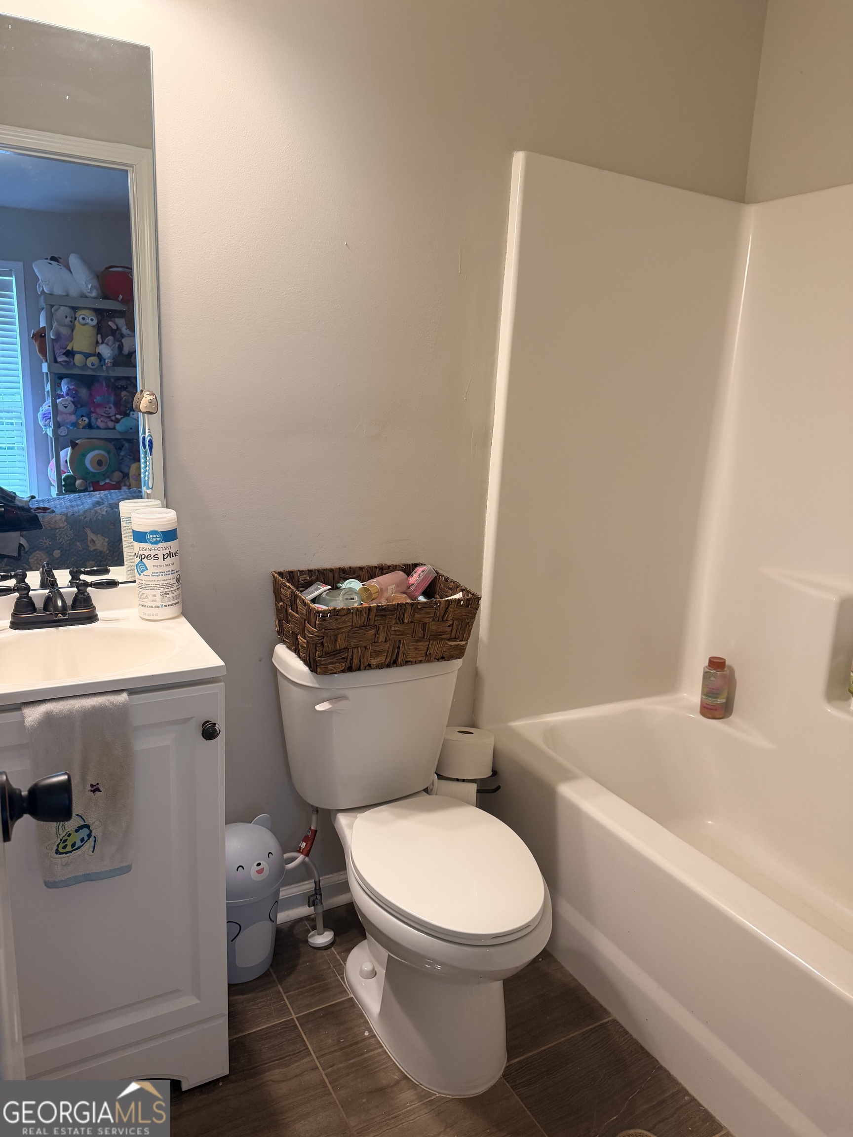 892 Perimeter Road Monticello, GA 31064 - Photo 28 of 38 a white toilet sitting next to a bathroom sink