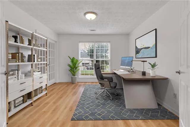a living room with furniture a rug and a window