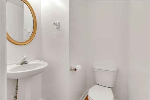 a bathroom with a toilet and a sink