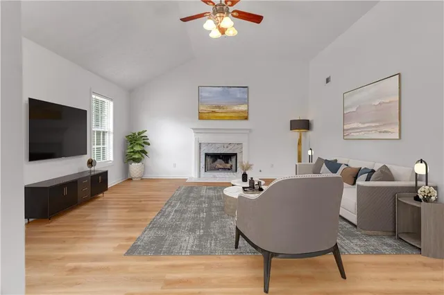 a living room with furniture and a flat screen tv