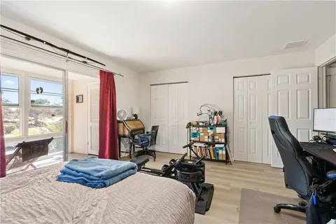 a bedroom with furniture and a window