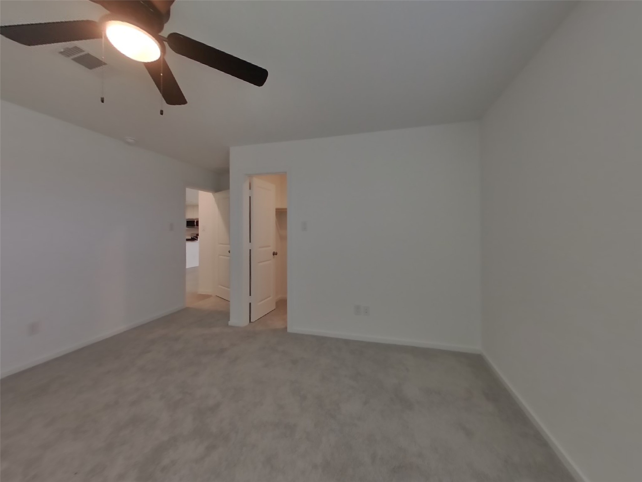3009 Merganser Ridge Drive Katy, TX 77493 - Photo 7 of 18 an empty room with chandelier fan