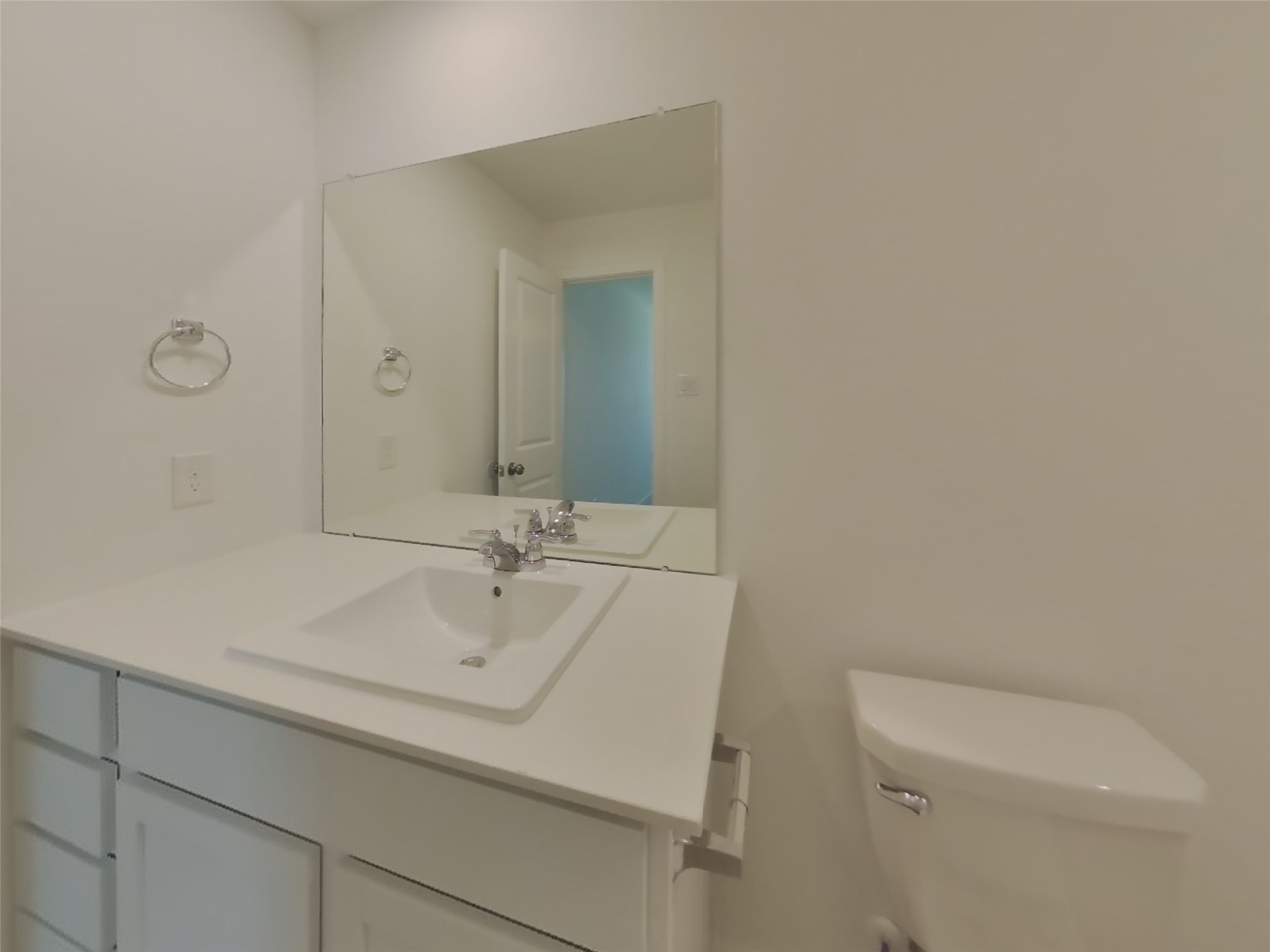 3009 Merganser Ridge Drive Katy, TX 77493 - Photo 9 of 18 a bathroom with a sink a toilet and mirror