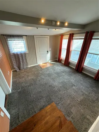 a view of an empty room and window