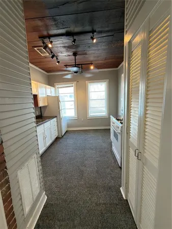 a view of a hallway with windows