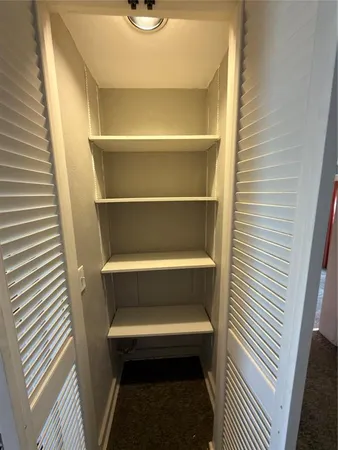 a toilet sitting on a wooden floor