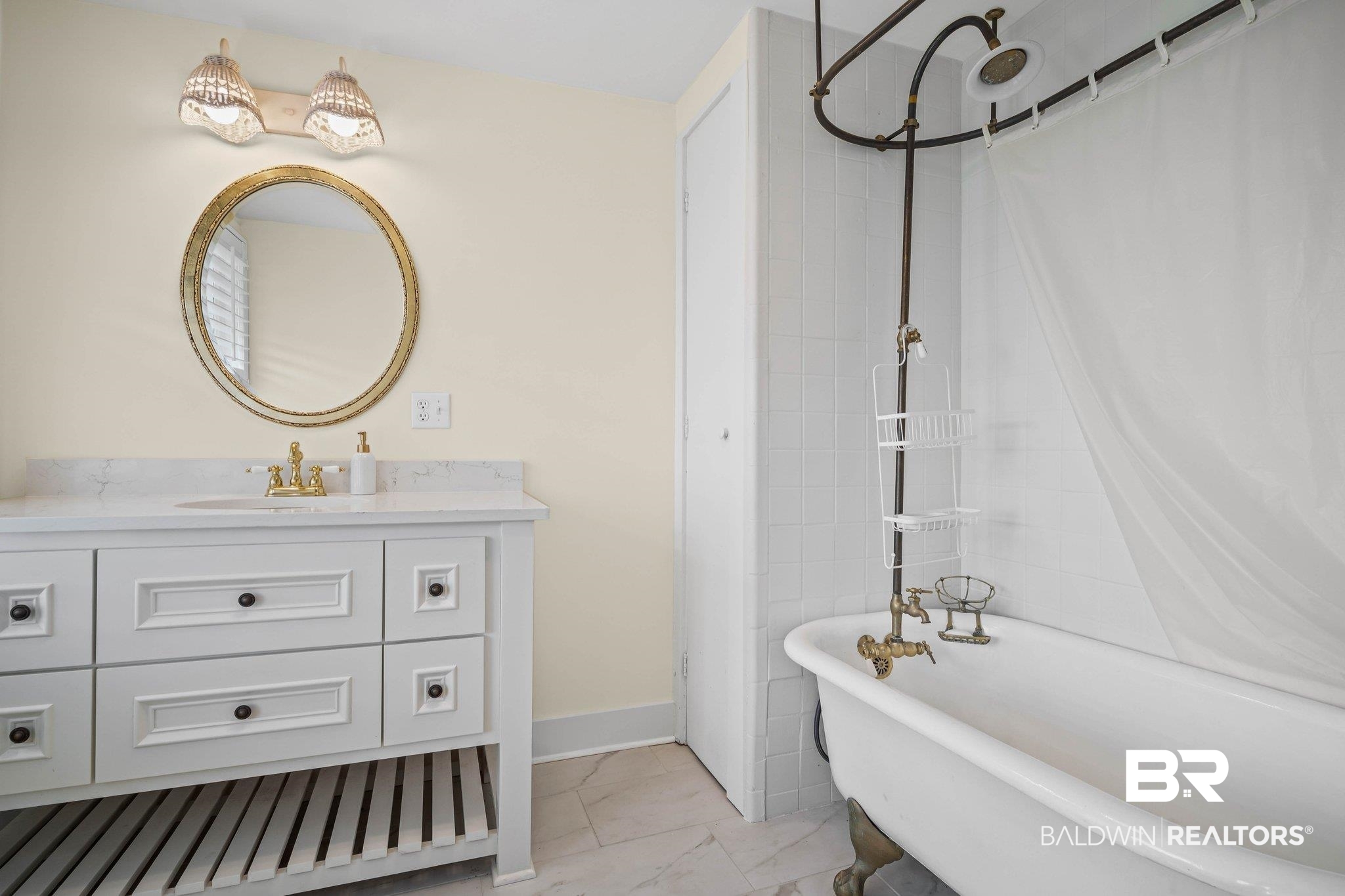 23561 Main Street Fairhope, AL 36532 - Photo 21 of 45 Full bath with vanity, a combined bath / shower with freestanding tub, and light marble finish floors