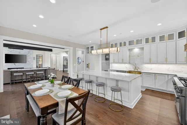 a view of room with wooden floor and gym equipment