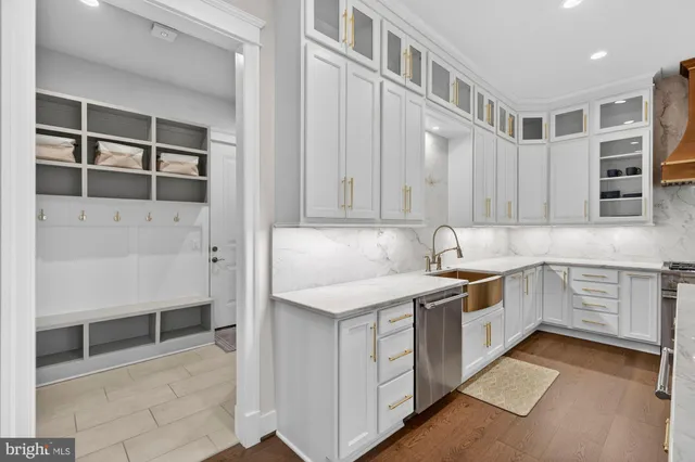 a view of a hallway with entryway and chandelier