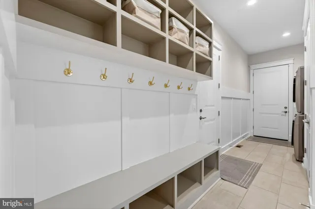 a bedroom with a large bed and a large window