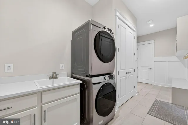 a spacious bedroom with a bed and a flat screen tv