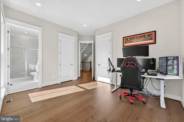 a spacious bathroom with a double vanity sink a mirror and a bathtub