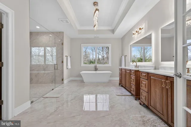 a view of a hallway with wooden floor and a fireplace