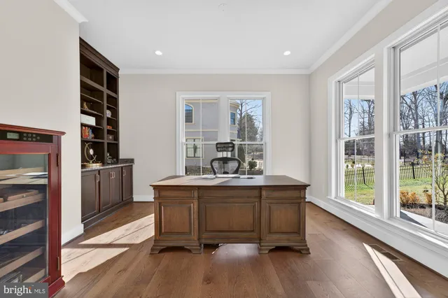 a view of a dining room with furniture wooden floor and chandelier