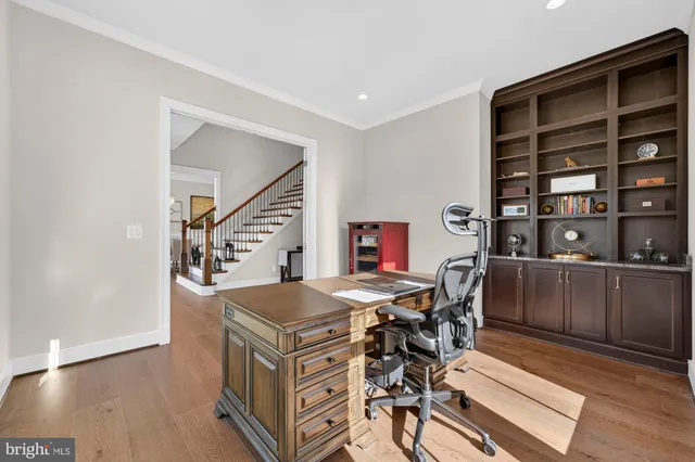 a view of a dining room with furniture wooden floor and chandelier