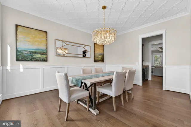 wooden floor with an entryway and livingroom with furniture