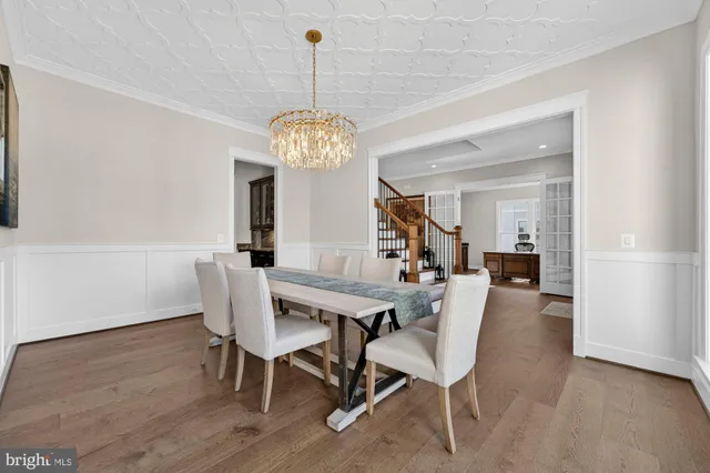 a living room with lots of furniture and a wooden floor